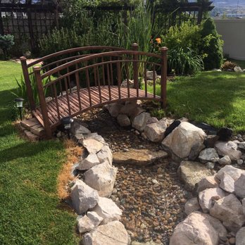 Superior Outdoors - a wooden bridge over a stream - Landscaping Near Me - West Haven, Utah