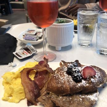 AC Sky Bar - Creme brûlée French toast with added eggs ($$) and cranberry mimosa - Bars Near Me - Orlando, Florida AC Sky Bar - Creme brûlée French toast with added eggs ($$) and cranberry mimosa - Bars Near Me - Orlando, Florida