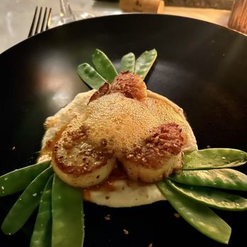 Porterhouse - Seared scallops on cauliflower purée with steamed snap peas topped with sweet carrot foam - Steakhouses Near Me - El Segundo, California Porterhouse - Seared scallops on cauliflower purée with steamed snap peas topped with sweet carrot foam - Steakhouses Near Me - El Segundo, California
