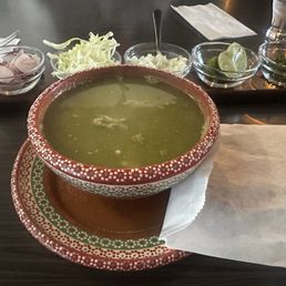 Green pozole and toppings galore Green pozole and toppings galore