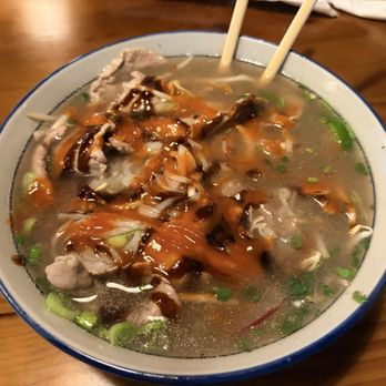 Sup Vietnamese Pho & Grill - P9. Pho Tai topped with sriracha sauce and Husain sauce. - Noodles Near Me - Pasadena, Texas