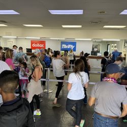 Dollar Car Rental - Expect a two hour wait to see an agent