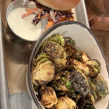 New Realm Brewing - Spicy chicken sandwich and Brussels sprouts - Brewpubs Near Me - Charleston, South Carolina New Realm Brewing - Spicy chicken sandwich and Brussels sprouts - Brewpubs Near Me - Charleston, South Carolina