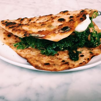 Joule - "Pancake" - green scallion pancake with kale, two poached eggs and peanut sauce - at Joule during weekend brunch. - Korean Near Me - Seattle, Washington Joule - "Pancake" - green scallion pancake with kale, two poached eggs and peanut sauce - at Joule during weekend brunch. - Korean Near Me - Seattle, Washington