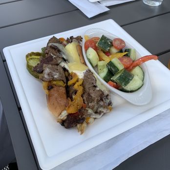 Pemi Public House - Steak and cheese sandwich with cucumber salad - American Near Me - Woodstock, New Hampshire Pemi Public House - Steak and cheese sandwich with cucumber salad - American Near Me - Woodstock, New Hampshire