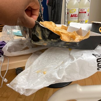 Buffalo Wild Wings - a hand holding a bag of chips - Sports Bars Near Me - Augusta, Georgia Buffalo Wild Wings - a hand holding a bag of chips - Sports Bars Near Me - Augusta, Georgia