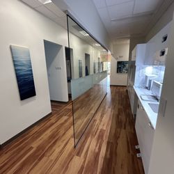 Comfort Care Dental - View of the hallway looking at several rooms for patients