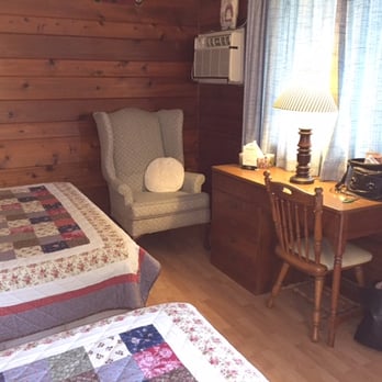 Chateau Lodge - Comfy wing-back chair. Center desk drawer contained a binder with tv channel guides and motel info, - Hotels Near Me - Oregon, Illinois