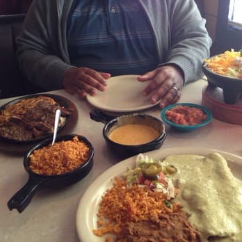 Chuy's - Fajitas, and chicken enchiladas with deluxe tomatillo sauce. - Mexican Near Me - Rogers, Arkansas Chuy's - Fajitas, and chicken enchiladas with deluxe tomatillo sauce. - Mexican Near Me - Rogers, Arkansas