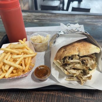 Mother Falafel - Side of fries, chicken pita sandwich with a side of red sauce and sour kraut. - Falafel Near Me - Las Vegas, Nevada Mother Falafel - Side of fries, chicken pita sandwich with a side of red sauce and sour kraut. - Falafel Near Me - Las Vegas, Nevada