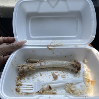 Granny's Kitchen Southern Style Soul Food - a person's hand holding a fork and a plastic container with food in it - Soul Food Near Me - Los Angeles, California