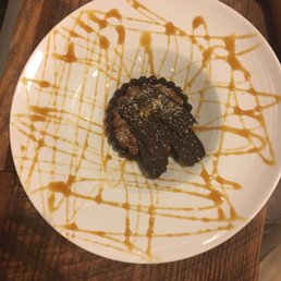 a chocolate dessert with caramel drizzle a chocolate dessert with caramel drizzle