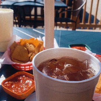 Rodeo Restaurant - a drink and chips on a table - Mexican Near Me - Gonzales, Texas Rodeo Restaurant - a drink and chips on a table - Mexican Near Me - Gonzales, Texas