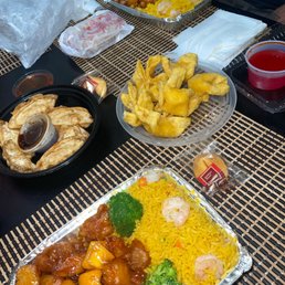 Fried dumplings, crab rangoons, orange chicken with rice and vegetables, and sesame chicken with rice. Came with eggrolls. Fried dumplings, crab rangoons, orange chicken with rice and vegetables, and sesame chicken with rice. Came with eggrolls.