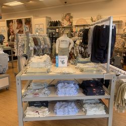 Carter's Babies & Kids - Cute baby clothes neatly displayed.