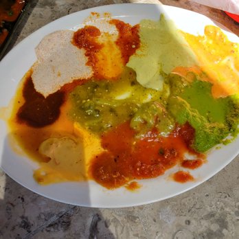 Curra's Grill - Oltorf - This is their salsa "sampler". Why is it on a plate? Why is it all melding into one another? - Mexican Near Me - Austin, Texas Curra's Grill - Oltorf - This is their salsa "sampler". Why is it on a plate? Why is it all melding into one another? - Mexican Near Me - Austin, Texas