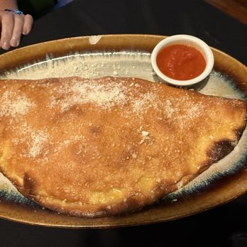 Toni's Italian Restaurant - One massive calzone - Italian Near Me - Shawnee, Kansas Toni's Italian Restaurant - One massive calzone - Italian Near Me - Shawnee, Kansas