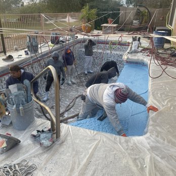 Tropics Pools & Spas - Crew laying new finish installed waiting - Pool & Hot Tub Service Near Me