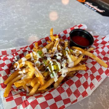Takoda Navy Yard - Loaded Fries with Cheese, Sour Cream, Jalapeños and Bacon Bits - Beer Gardens Near Me - Washington, DC, District of Columbia Takoda Navy Yard - Loaded Fries with Cheese, Sour Cream, Jalapeños and Bacon Bits - Beer Gardens Near Me - Washington, DC, District of Columbia