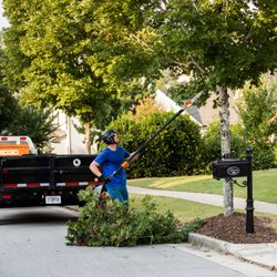 SingingTree - Raising the skirt on a few Maple trees to meet HOA code on sidewalk and street clearance for some of the residents of Sterling on the Lake.
