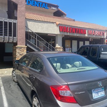 Valentína Market - a car parked in front of a store - Grocery Near Me - Lake Forest, California