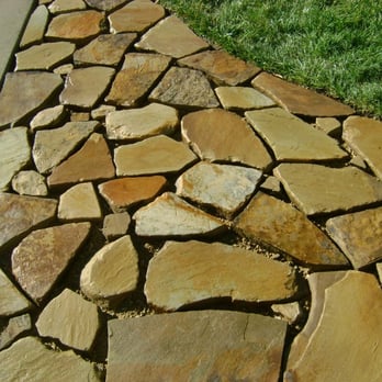 Dirt Clods Landscaping - a closeup of a stone walkway - Landscaping Near Me Dirt Clods Landscaping - a closeup of a stone walkway - Landscaping Near Me