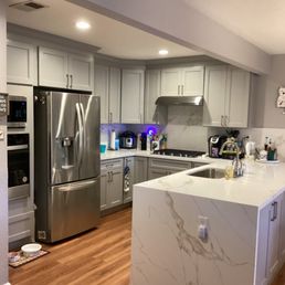 Beautiful kitchen with waterfall counter and full backsplash