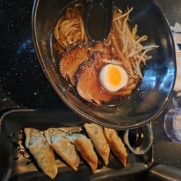 shoyu ramen and side of dumplings