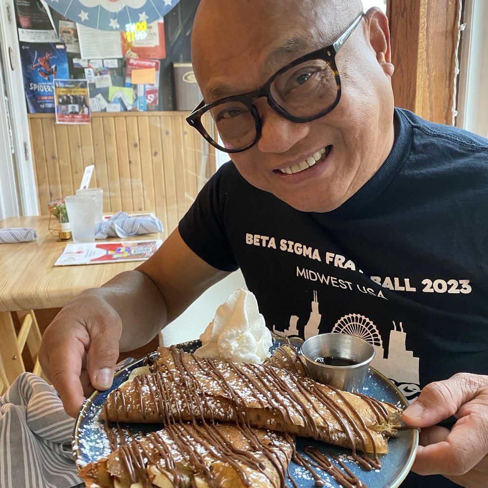 Don Julio Cafe - Hubby with his plate of banana Nutella crepes and chocolate - Breakfast & Brunch Near Me - Skokie, Illinois