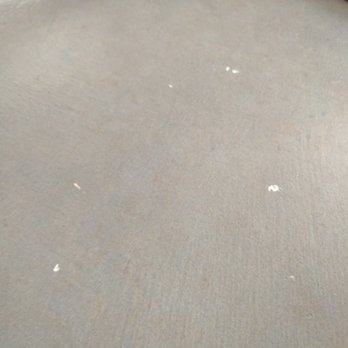 Applied Concrete Solutions - One ex. of MANY paint drips and white chips covering the floor. Their concrete overlay chips with anything dropped on it. - Flooring Near Me - Cedar Park, Texas Applied Concrete Solutions - One ex. of MANY paint drips and white chips covering the floor. Their concrete overlay chips with anything dropped on it. - Flooring Near Me - Cedar Park, Texas