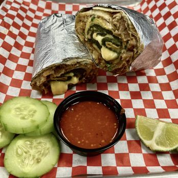 Encanto Tacos & Micheladas - chile relleno burrito comes with cucumbers and lime on the side - Tacos Near Me - Corona, California Encanto Tacos & Micheladas - chile relleno burrito comes with cucumbers and lime on the side - Tacos Near Me - Corona, California