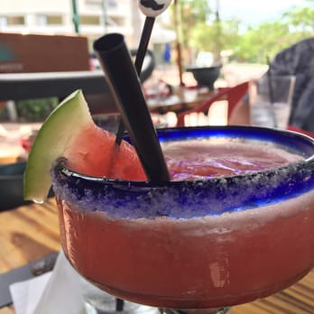Calaveras Cantina - Watermelon margarita with candy sugar skull. - Mexican Near Me - Jupiter, Florida