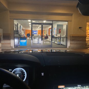 AT&T Store - Customer service representative lounging and watching the news after he asked me to leave! Unbelievable! Who sits like that at work? - Mobile Phones Near Me - Porter Ranch, California