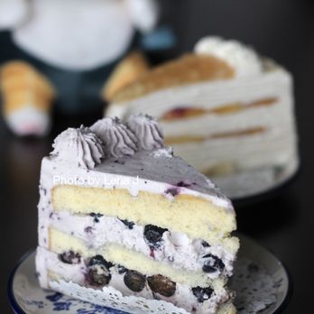 Moment - Blueberry Whipped Cream Cake 蓝莓奶油蛋糕 ($8.50) + White Peach Oolong Mille Crepe 白桃乌龙千层 ($9.75). Both very good. Blueberry cake is sweeter. - Bakeries Near Me - Champaign, Illinois