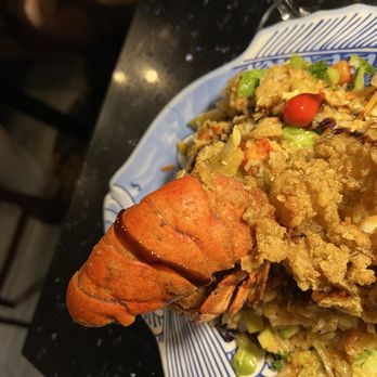 Poor Calvin's - Lobster fried rice with deep fried tail on top. - Asian Fusion Near Me - Atlanta, Georgia Poor Calvin's - Lobster fried rice with deep fried tail on top. - Asian Fusion Near Me - Atlanta, Georgia
