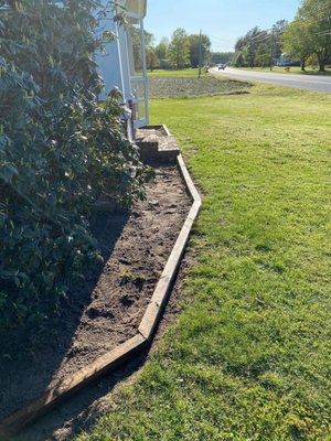 Building flower beds - Came out later border, stained it and then filled with mulch Building flower beds - Came out later border, stained it and then filled with mulch