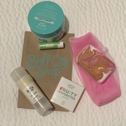 Buff City Soap - Body Butter (green tub), Lotion Bar (white stick), "All Hail the Queen" soap, and chapsticks