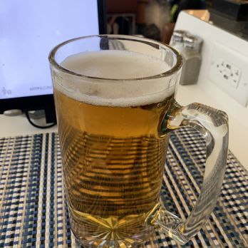 Novella - a mug of beer on a table - New American Near Me - Newark, New Jersey