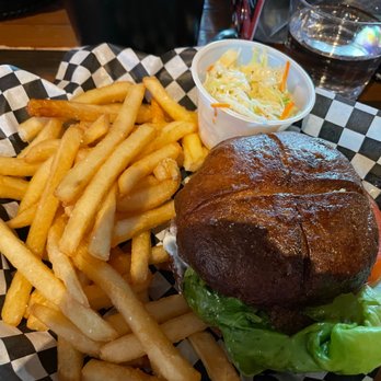 Ghostfish Brewing - Gluten Free Pretzel bun hamburger with fries and coleslaw on the side. - Breweries Near Me - Seattle, Washington