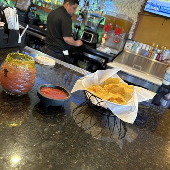 Frida's Modern Mexican - Blueberry Margarita with chips and salsa. - Mexican Near Me - Athens, Ohio Frida's Modern Mexican - Blueberry Margarita with chips and salsa. - Mexican Near Me - Athens, Ohio
