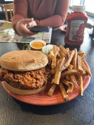 Photo of Lindy's Diner - Albuquerque, NM, US. The mother cluckin sandwich fries with nacho cheese on the side and a grilled jalapeño