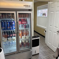 Soda drinks, some milk dessert(?),water, in fridge