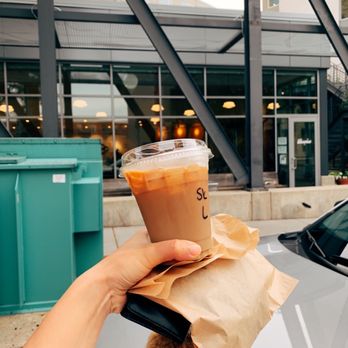 Likewise Coffee - Milwaukee - a hand holding a cup of coffee - Coffee & Tea Near Me - Milwaukee, Wisconsin Likewise Coffee - Milwaukee - a hand holding a cup of coffee - Coffee & Tea Near Me - Milwaukee, Wisconsin