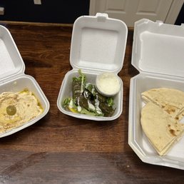 Hummus, pita bread, veggie grape leaves Hummus, pita bread, veggie grape leaves