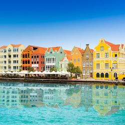 J Lamoglia - Dream Vacations - Explore Willemstad, Curaçao! Stroll Punda & Otrobanda, cross Queen Emma Bridge, and enjoy Dutch-Caribbean charm. Book your getaway!