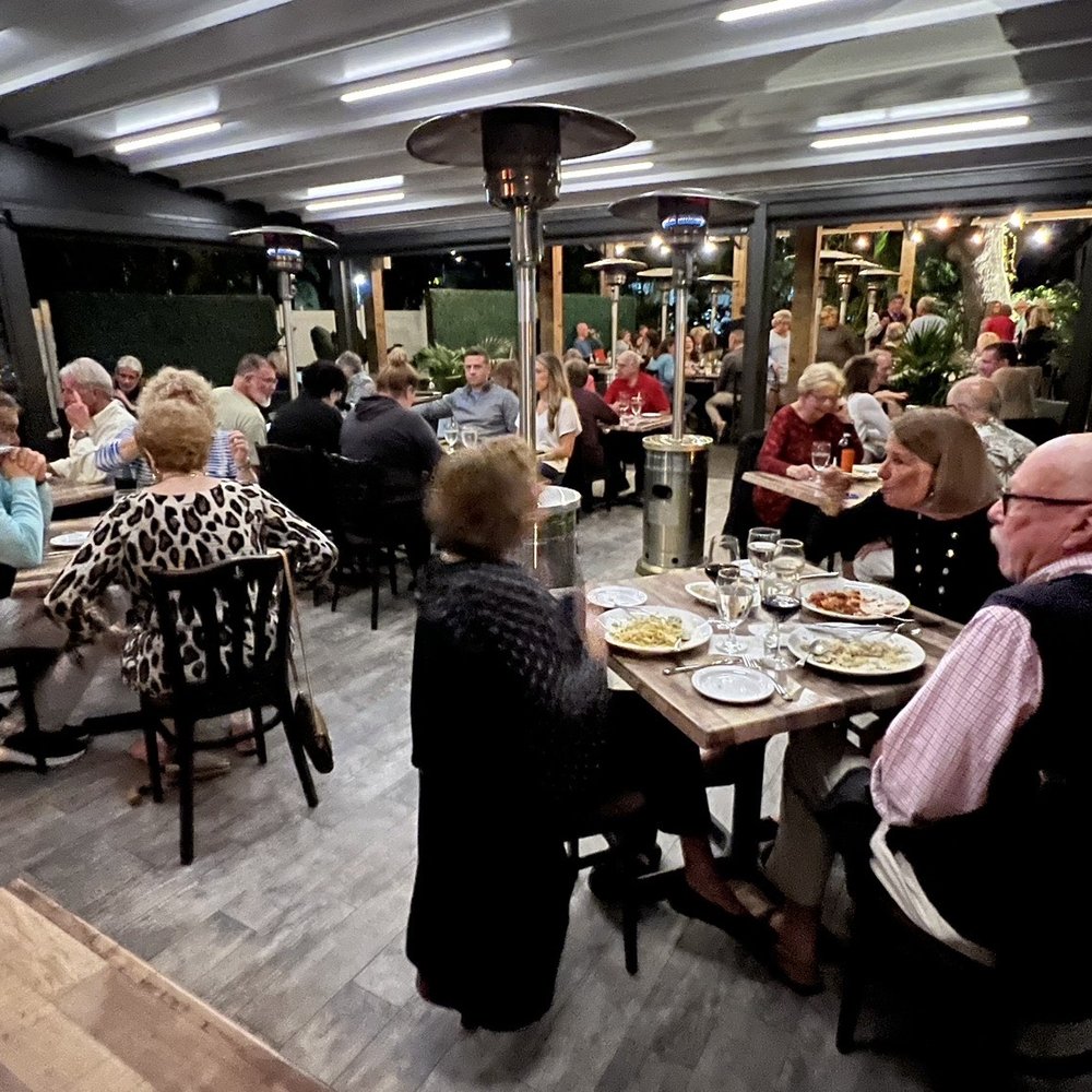 Scampi Grill - Outside sitting area. - Italian Near Me - Vero Beach, Florida Scampi Grill - Outside sitting area. - Italian Near Me - Vero Beach, Florida