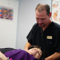 Burleigh Health Center & Rehab - Dr. Larry Burleigh providing chiropractic care to a patient at Burleigh Health Center & Rehab.