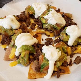 Taco Dále - Half order of Mexican style nachos ($8.20): steak, beans, queso, guacamole & sour cream on individual chips - Mexican Near Me - Lisle, Illinois Taco Dále - Half order of Mexican style nachos ($8.20): steak, beans, queso, guacamole & sour cream on individual chips - Mexican Near Me - Lisle, Illinois