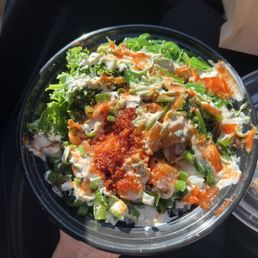 Togo Poke Bowl: White Rice, 1/4 lb Salmon, Crunchy Chili Garlic, Furikake, Green Onion, Kale, Seaweed Salad, and Tommy Sauce Togo Poke Bowl: White Rice, 1/4 lb Salmon, Crunchy Chili Garlic, Furikake, Green Onion, Kale, Seaweed Salad, and Tommy Sauce