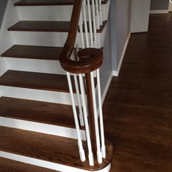 Personal Touch Wood Floors - Dark stain steps against the white risers and spindals